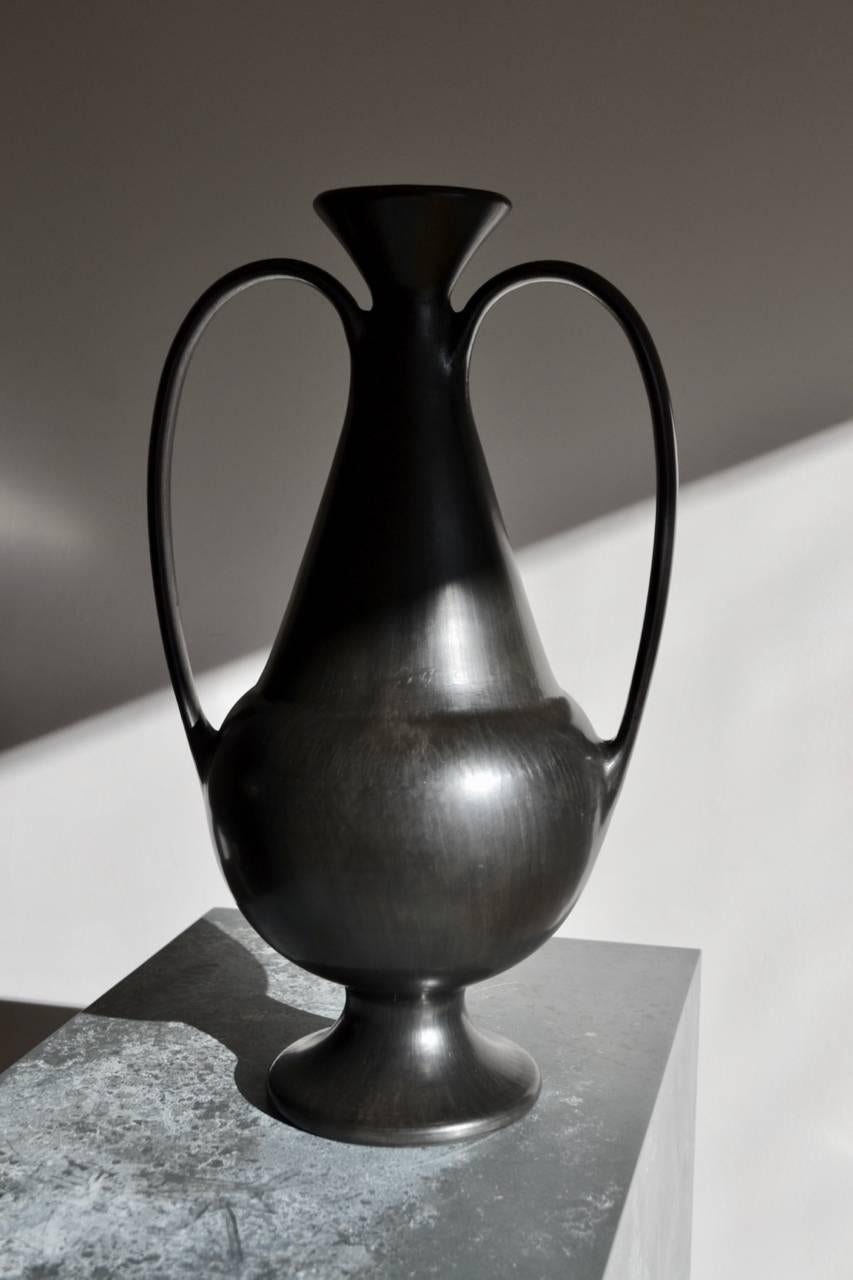 Bucchero Vase designed  by Gio Ponti and by the great Italian Artisan Carlo Alberto Rossi of the 40's.

The bucchero is a special clay, from the Etruscan times, was dried in open air and ,after baked in oven at very high temperature, which removes