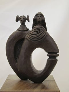 Kachina Man and Woman bronze sculpture by Dan Namingha, Hopi, Kachina, brown