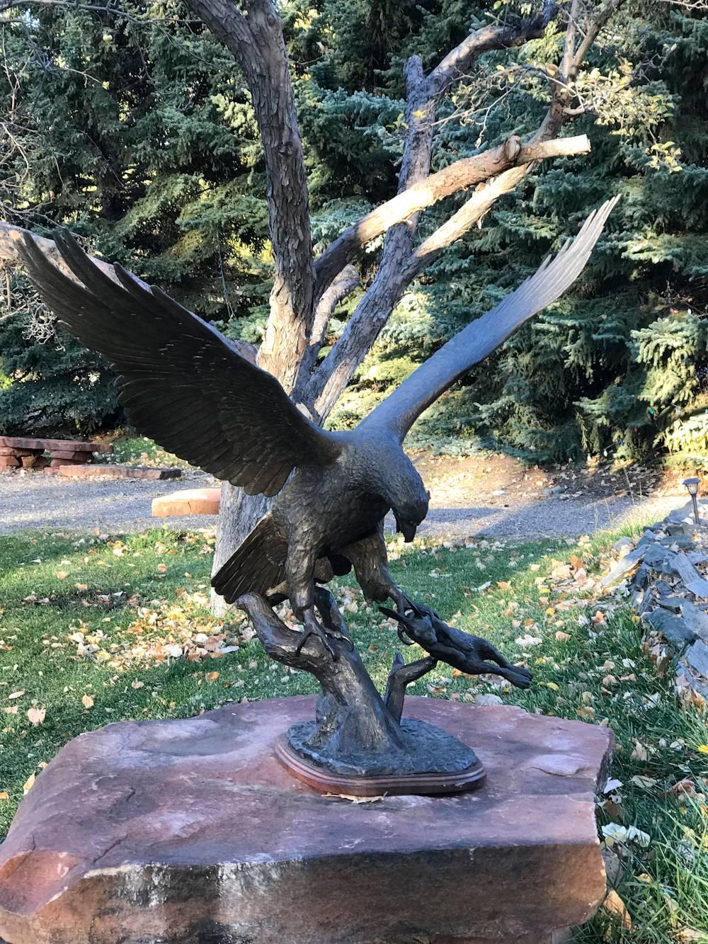 hawk rabbit statue
