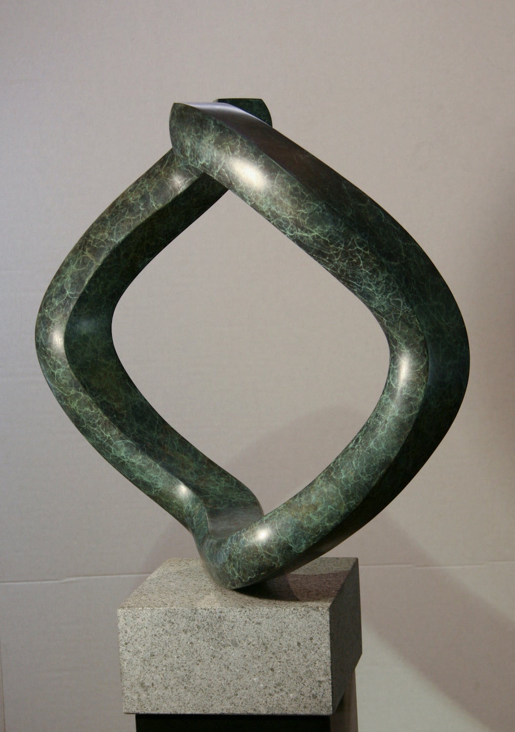Oh, by John Reeves, rotating, bronze, sculpture, shape shift, granite, edition