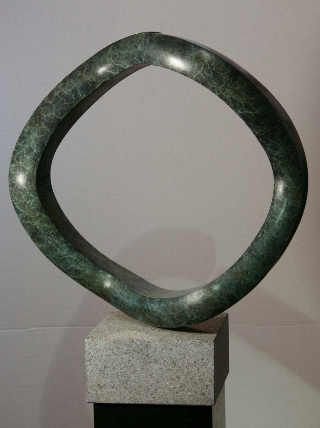 Oh, by John Reeves, rotating, bronze, sculpture, shape shift, granite, edition For Sale 1