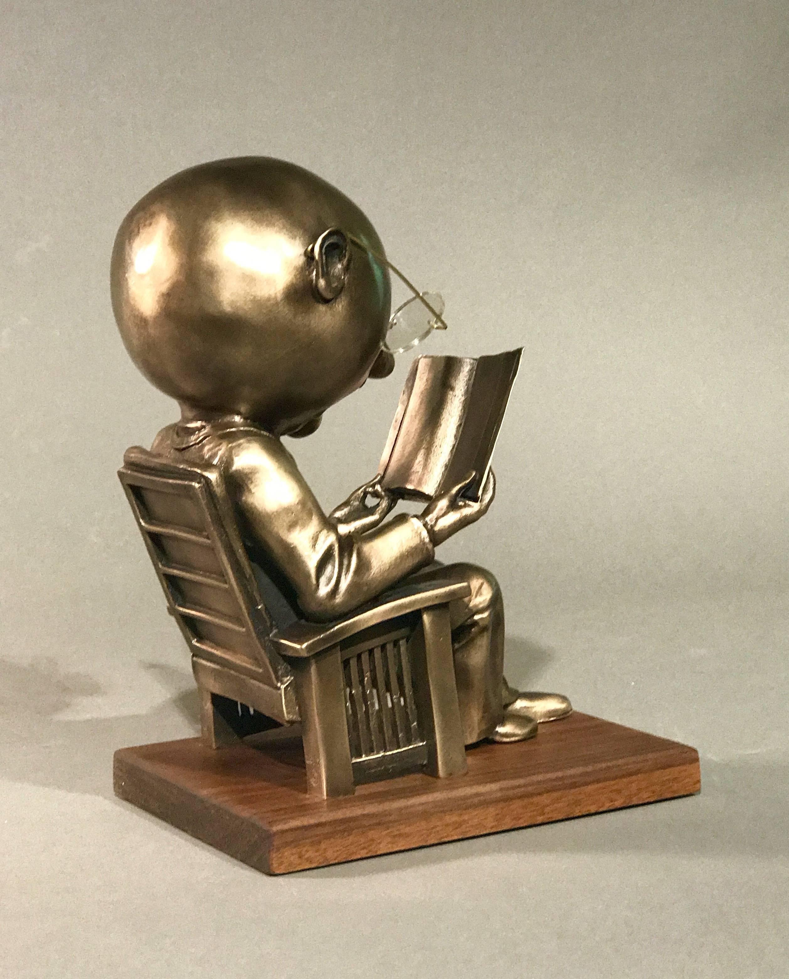 The Reader (small), gold bronze sculpture, reading book, glasses, Rodger Jacobsen 2