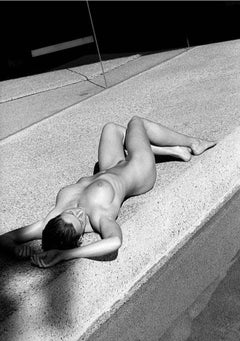 Carre Otis 4 - the nude model lying on a side walk in the sun