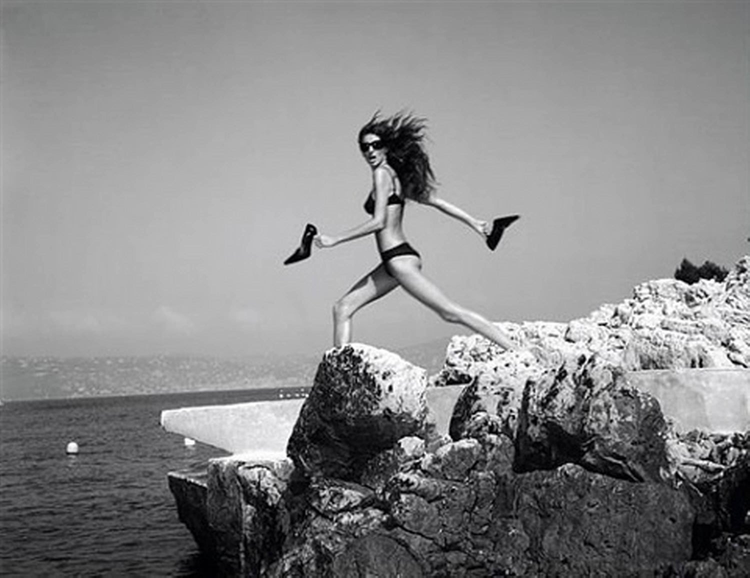 Michel Comte - Supermodel Gisele Bündchen in black bikini on rocks by the  sea near Cannes For Sale at 1stDibs