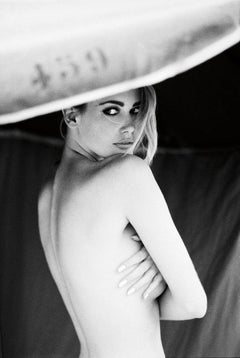 Supermodel Claudia Schiffer from the side, without top and bare back 