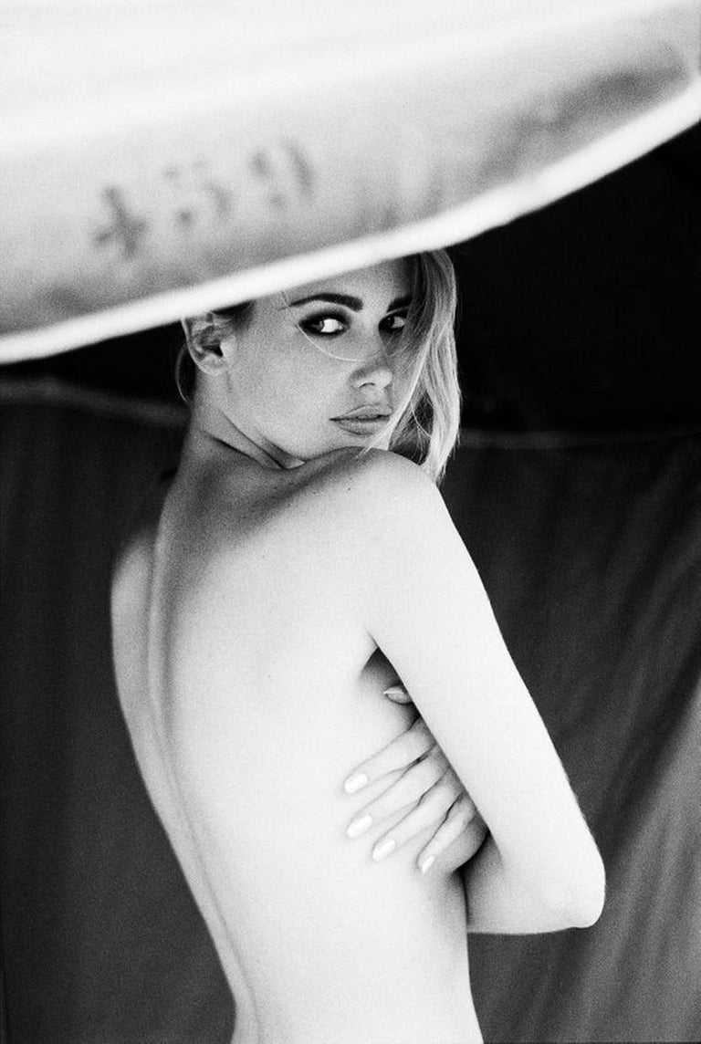 Ellen von Unwerth Black and White Photograph - Supermodel Claudia Schiffer from the side, without top and bare back 