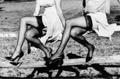 Leg Show II - Models in Stockings sitting on a fence, fine art photography, 2002