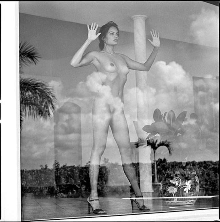 Guido Argentini Nude Photograph - Tully on a window full of clouds
