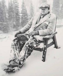 Jack Nicholson II - actor sitting outdoors in a wooden chair covered in snow