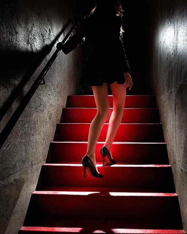 David Drebin Figurative Photograph - Girl on the red steps