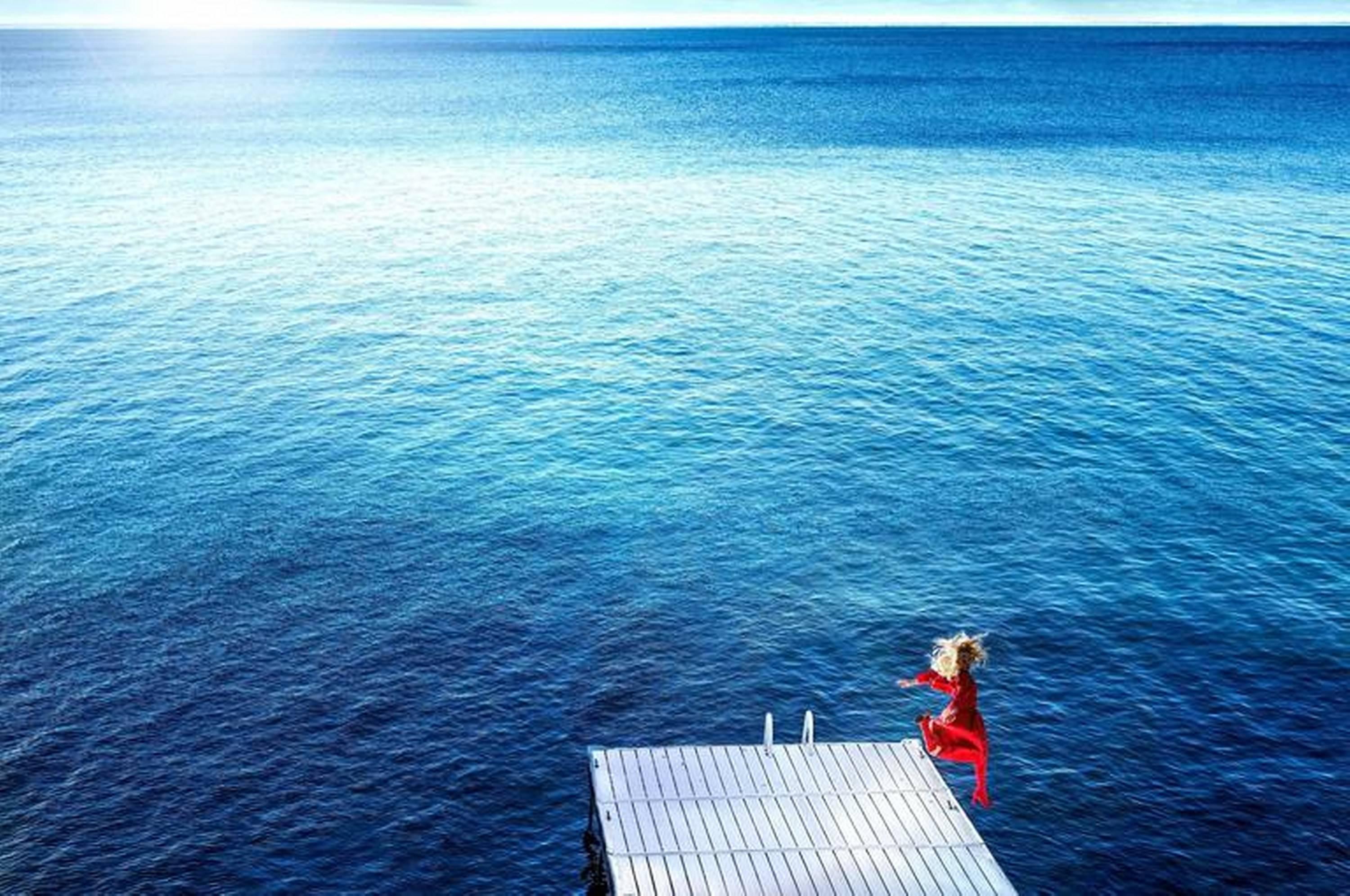 David Drebin Color Photograph – Jumping in the Blue