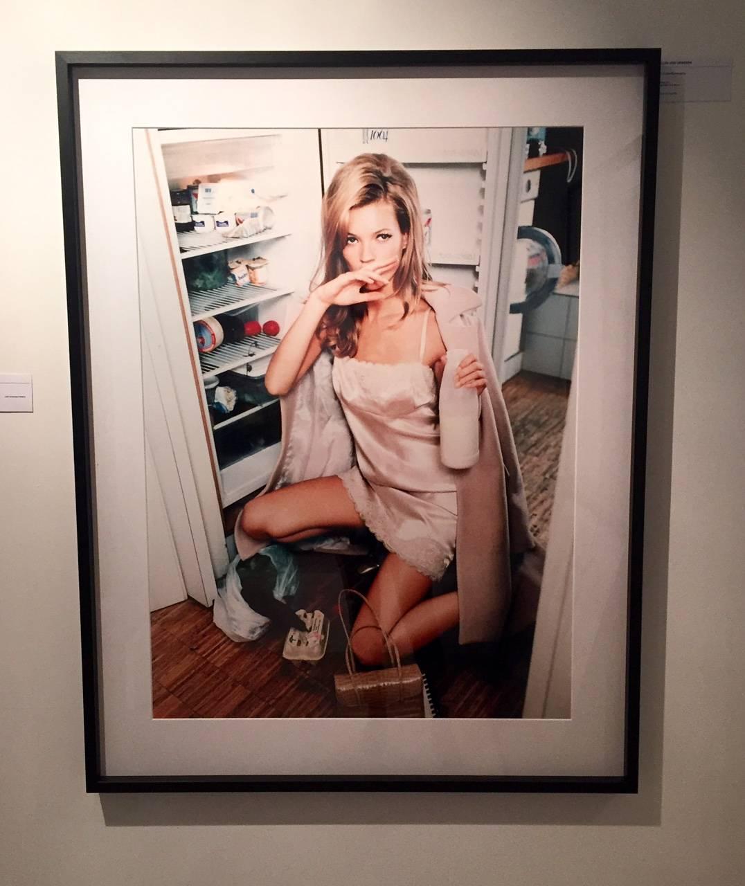 Kate Moss Shopping II - in a light pink negligee, coat and wiping her face off - Photograph by Ellen von Unwerth