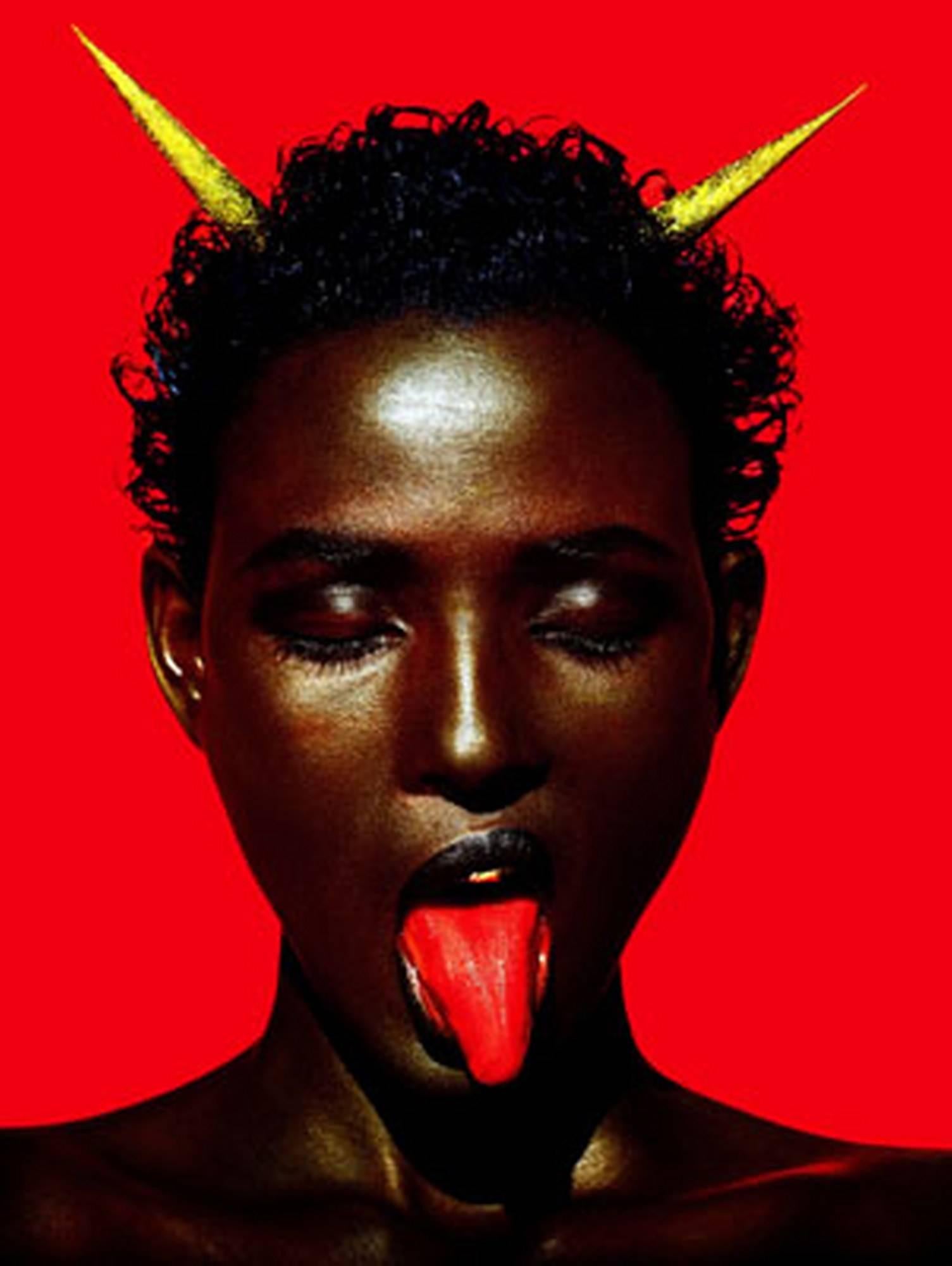Albert Watson Portrait Photograph - Waris Dirie Marrakech - iconic supermodel with red in the background