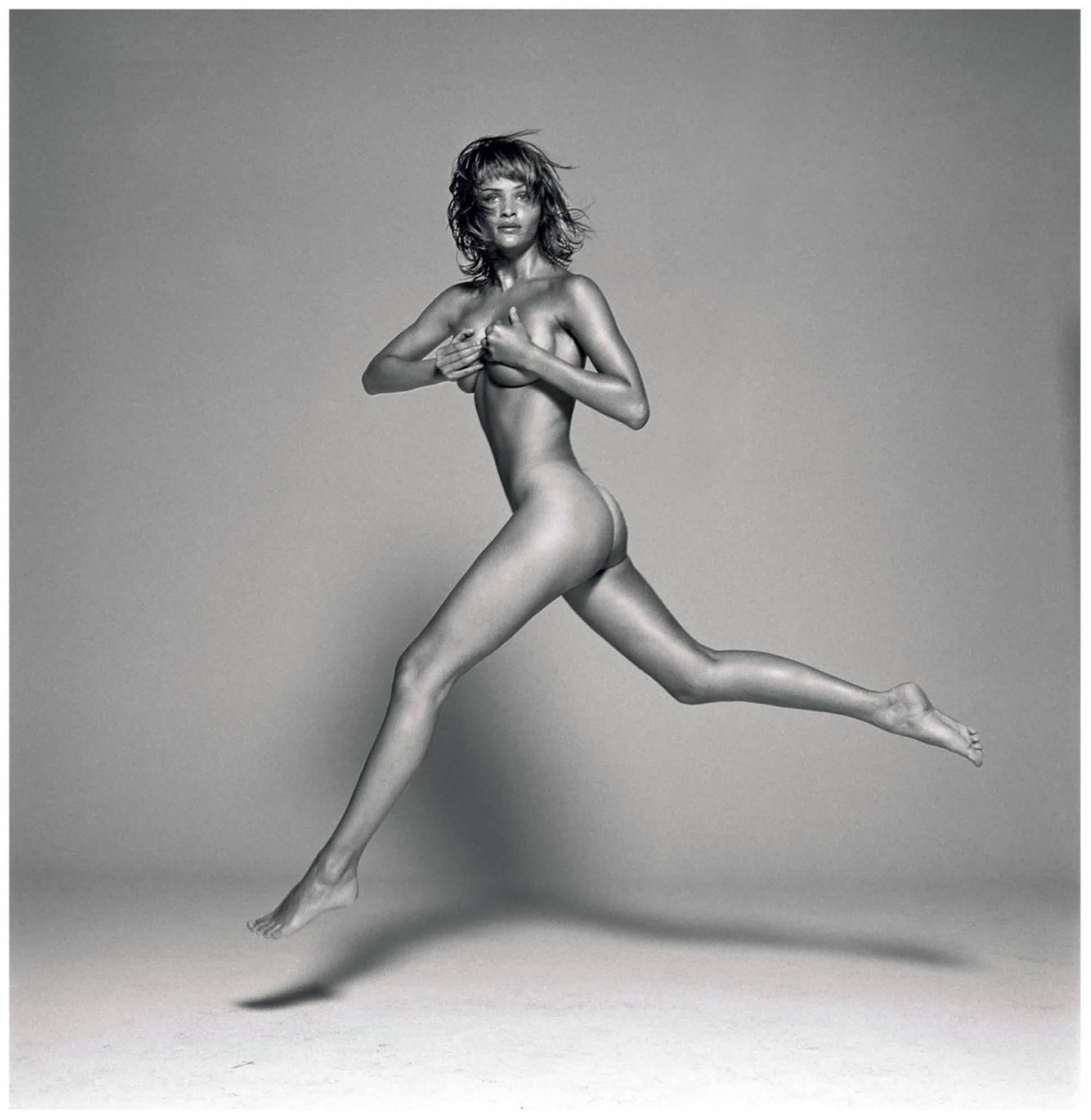 Michel Comte Black and White Photograph - Helena Christensen II - the nude supermodel jumping in the air 