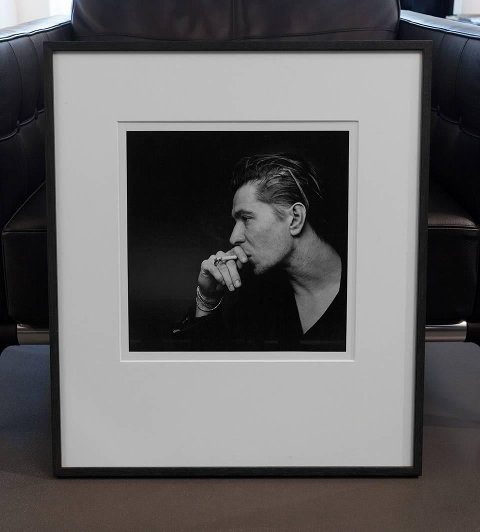 Gary Oldman, Soho London-  portratit of the movie star actor, producer smoking - Photograph by Nigel Parry