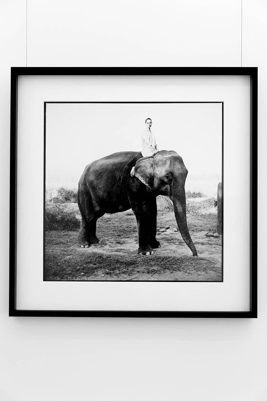 Kate Moss in Nepal, British Vogue - Model on elephant, fine art photography 1993 - Photograph by Arthur Elgort