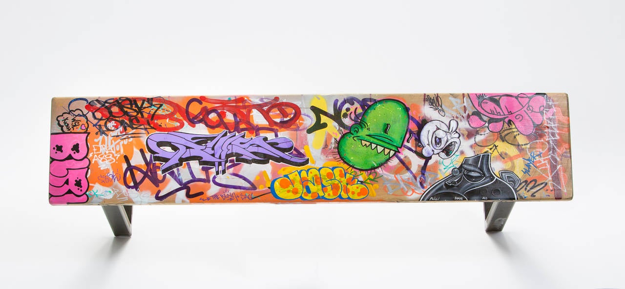 Spray paint, paint pens, and polyurethane on wood bench with steel legs