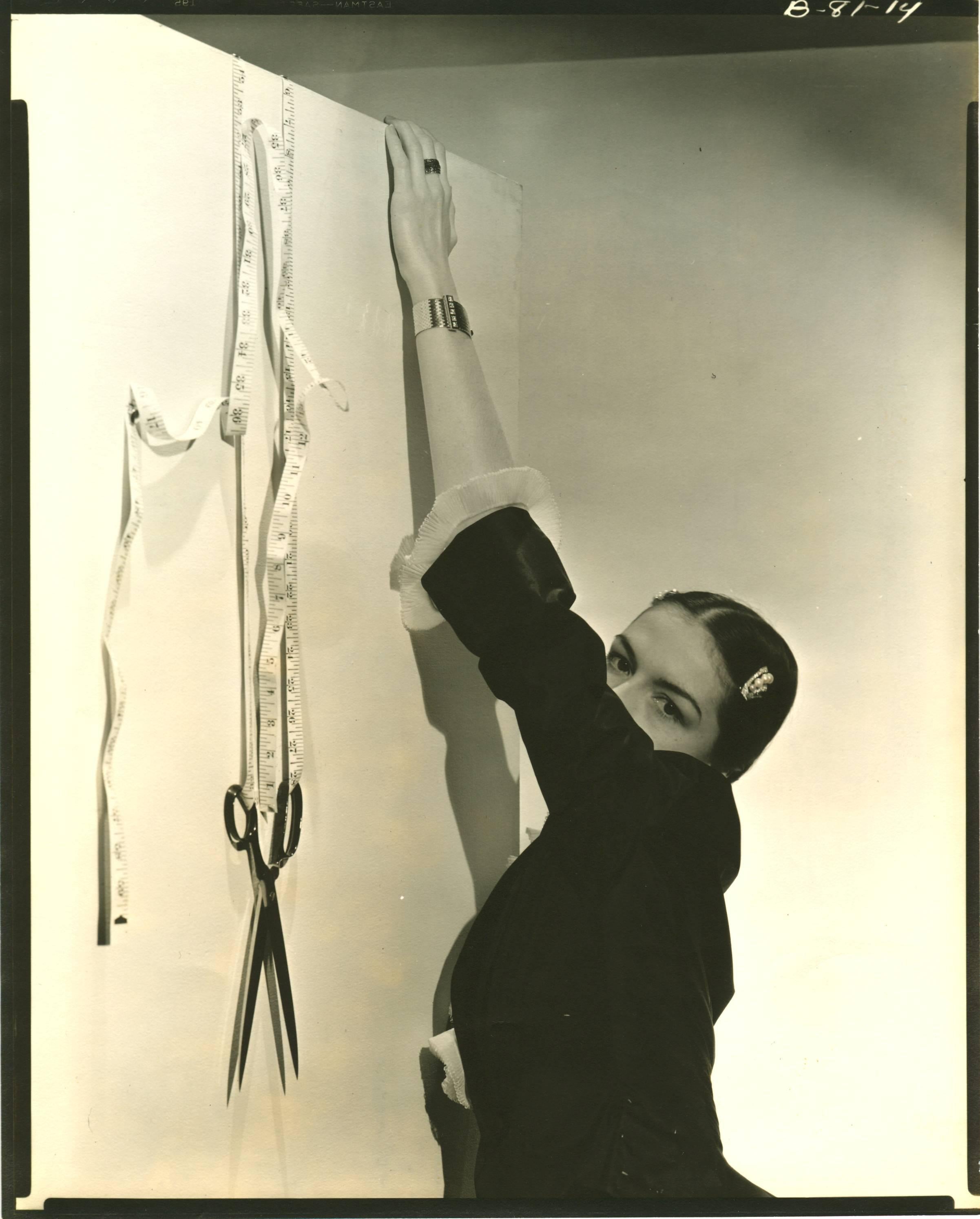 Cecil Beaton Black and White Photograph - Surreal Vignette, Ruth Ford with tapemeasure.