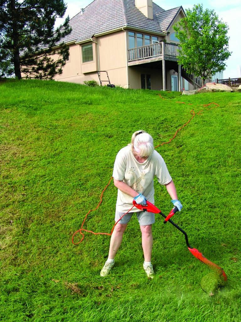 Bill Owens Portrait Photograph - New Suburbia, Hayward (Weed Wacker), from New Suburbia