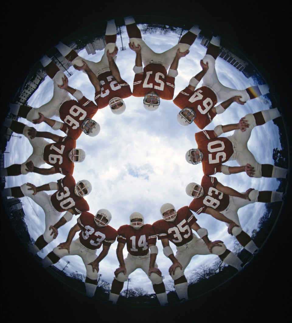 Neil Leifer Portrait Photograph - Texas Longhorns in Huddle, University of Texas vs. Notre Dame