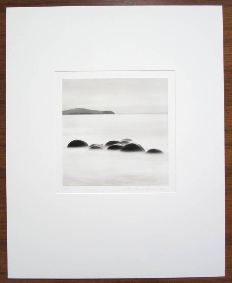 Nine Concretions, Koekohe Beach, Moeraki, New Zealand - Photograph by Michael Kenna