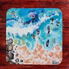 Swimmers in Turquoise Ocean Waves Aerial Coastal View Rocky Beach