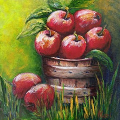 Red Apples in Rustic Wooden Basket with Green Leaves
