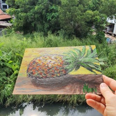 Tropical Pineapple on Wooden Table with Warm Yellow Background