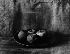 Photo of drawing on paper, wrapped around apples. Black and White photography.
