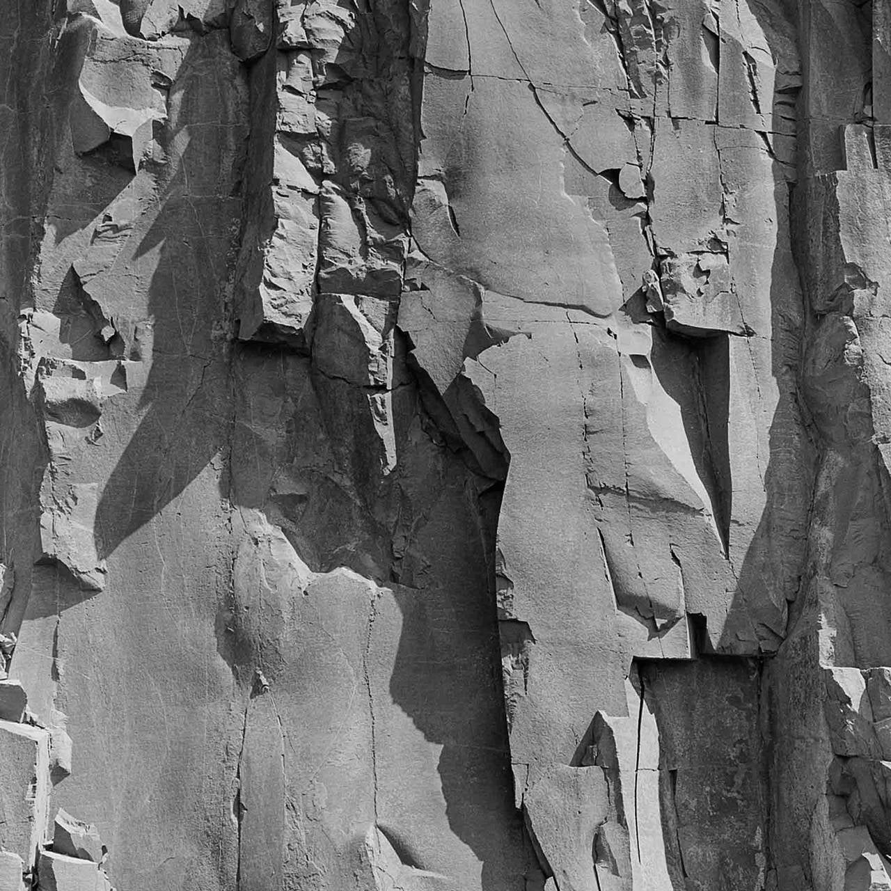 Andrew Buck Landscape Photograph - Rockface 13: Large Square Black & White Photograph of Graphic Jagged Rock Cliff