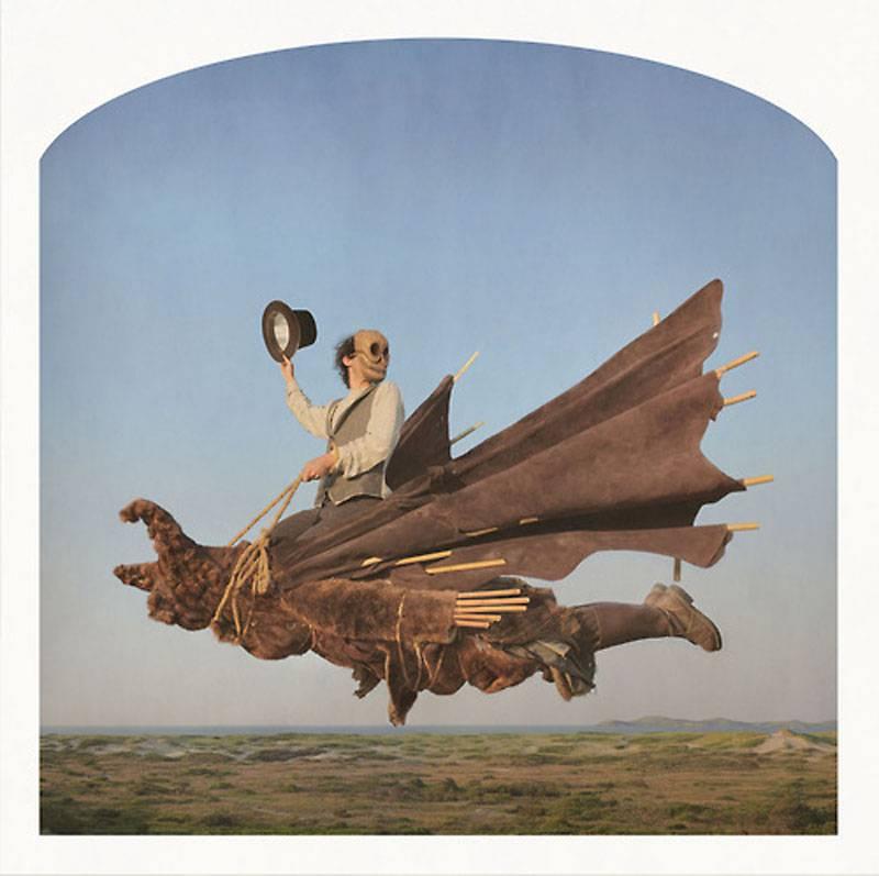 Nicholas Kahn & Richard Selesnick Color Photograph - The Dark Rider: Modern Surrealist Photo, Skull Masked Man Flying Over Landscape