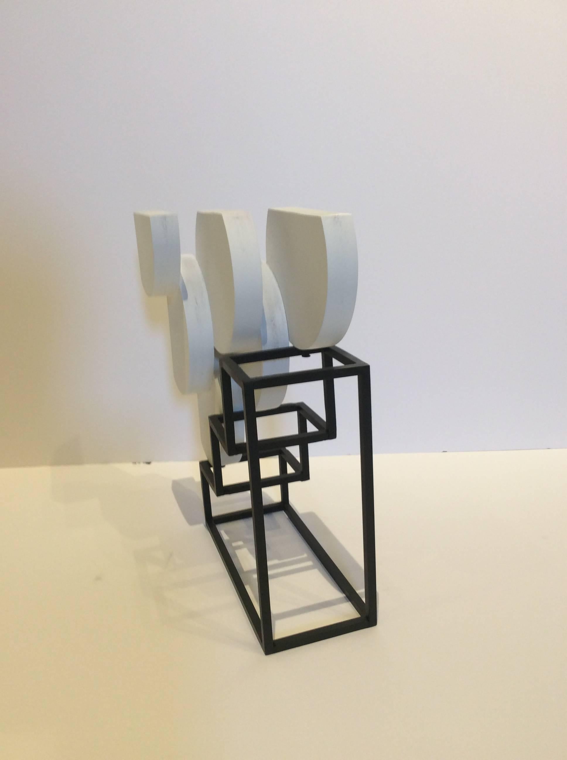 White abstract sculpture in mid century modern style
15 x 10 x 5 inches
white painted wood and black steel 

This small, contemporary abstract sculpture made of brightly painted white wood and black painted steel is perfectly suited for a tabletop,