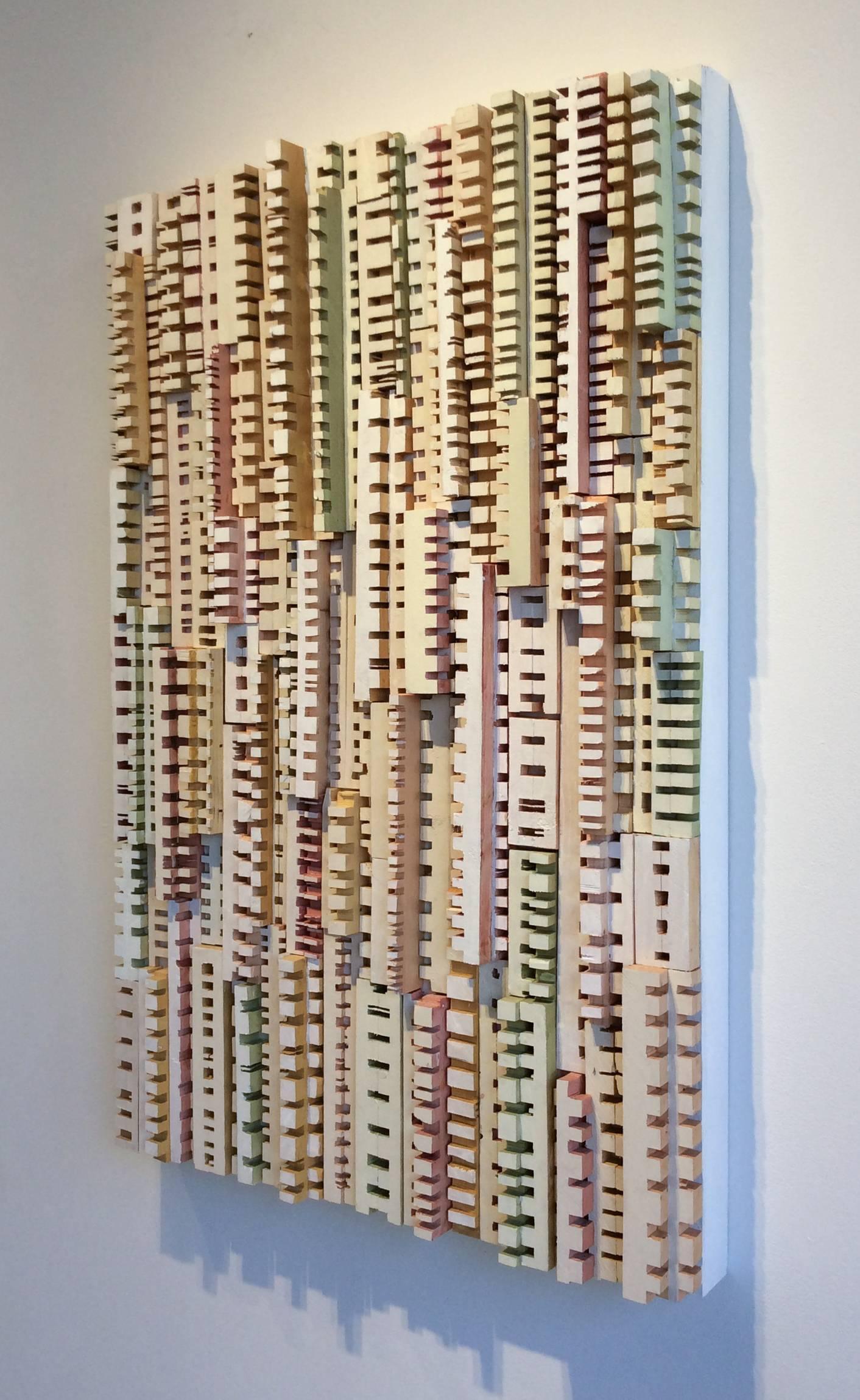 30 x 20 x 2 inches
Wood strips carefully carved and hand painted in acrylic with white, green, orange, yellow and maroon hues, adhered to a wood panel that measures 30 x 20 inches.

This modern, abstract three-dimensional wall sculpture was made by