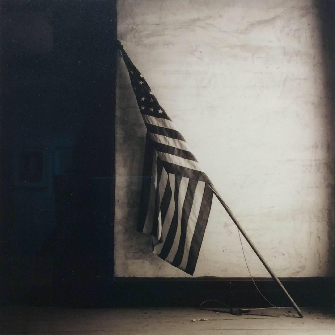 American Flag (Sepia Toned Still Life of Vintage Flag Leaning Against Wall)