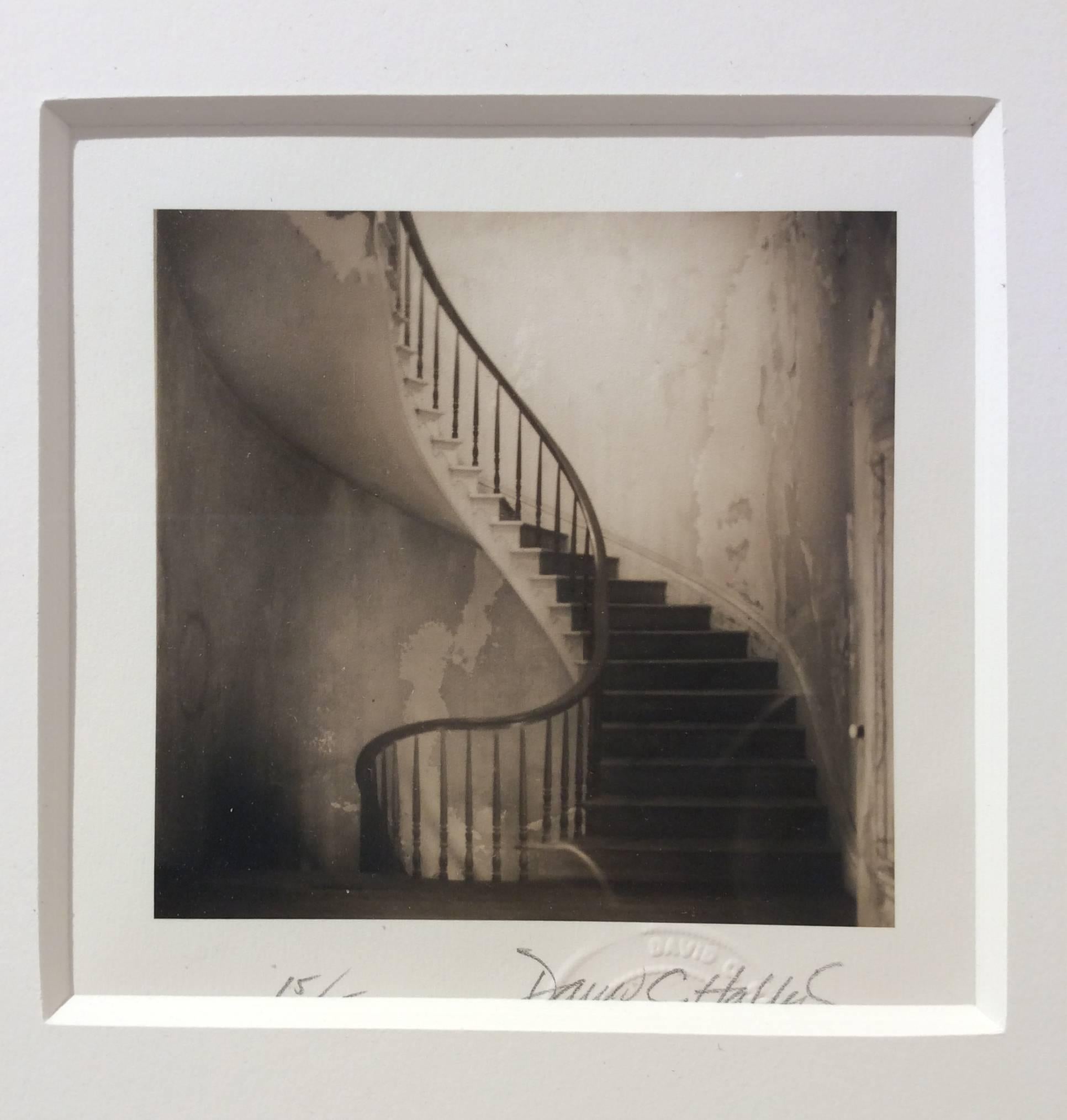 Staircase (Quadrat, Sepia getönte Vintage-Fotografie eines Spiralstaircase) (Schwarz), Black and White Photograph, von David Halliday