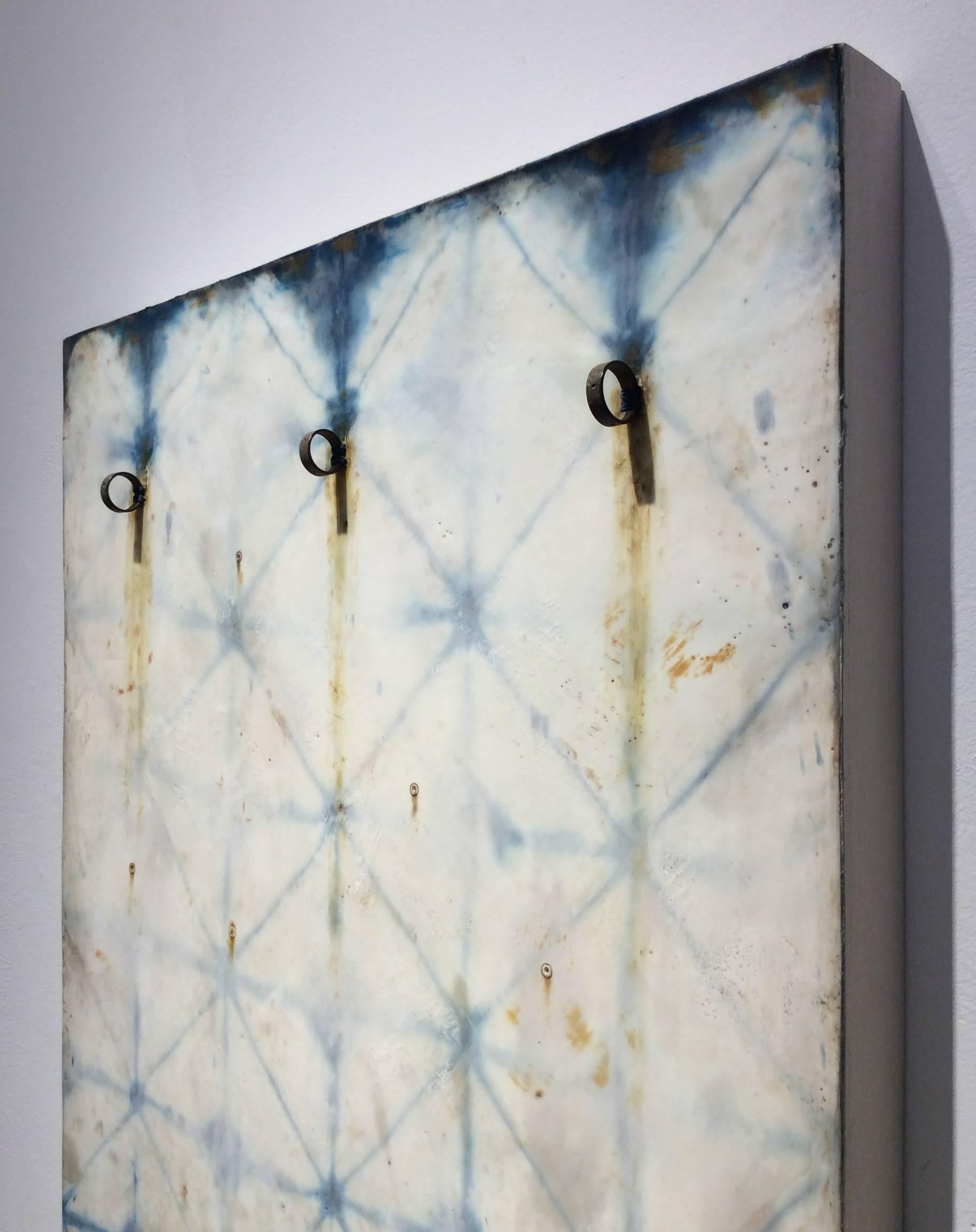 Hand dyed indigo silk, encaustic, and found objects on wood panel
36 x 18 x 2.5 inches

This vertical contemporary pattern-based abstract silk and encaustic work on panel was created by San Francisco-based artist Susan Stover as part of her Indigo