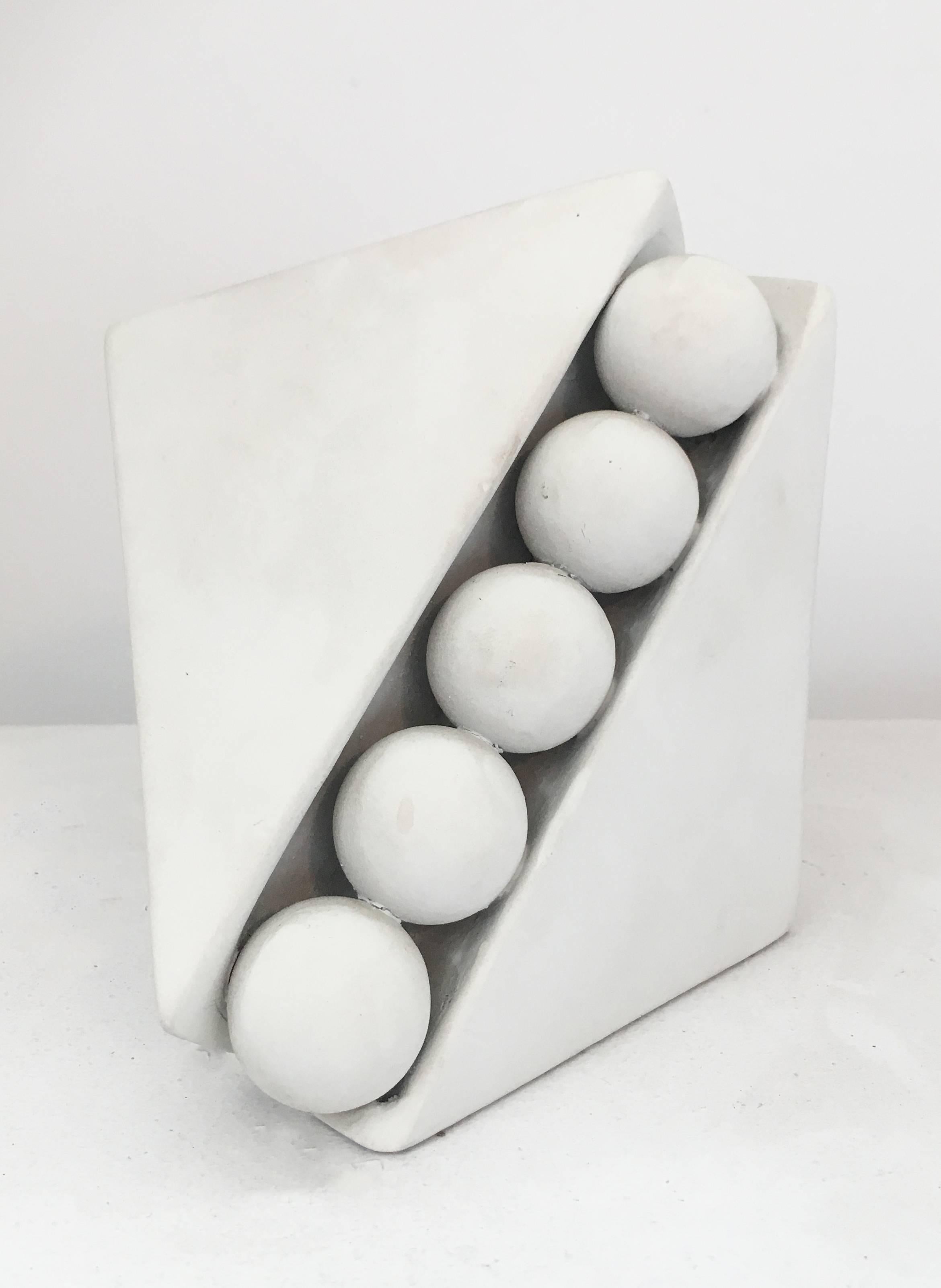 Small abstract white sculpture in mid century modern style
White painted wood and copper
6 x 6 x 6 inches

This small, contemporary abstract sculpture made of white painted wood and copper is perfectly suited for a tabletop, pedestal, or mantle