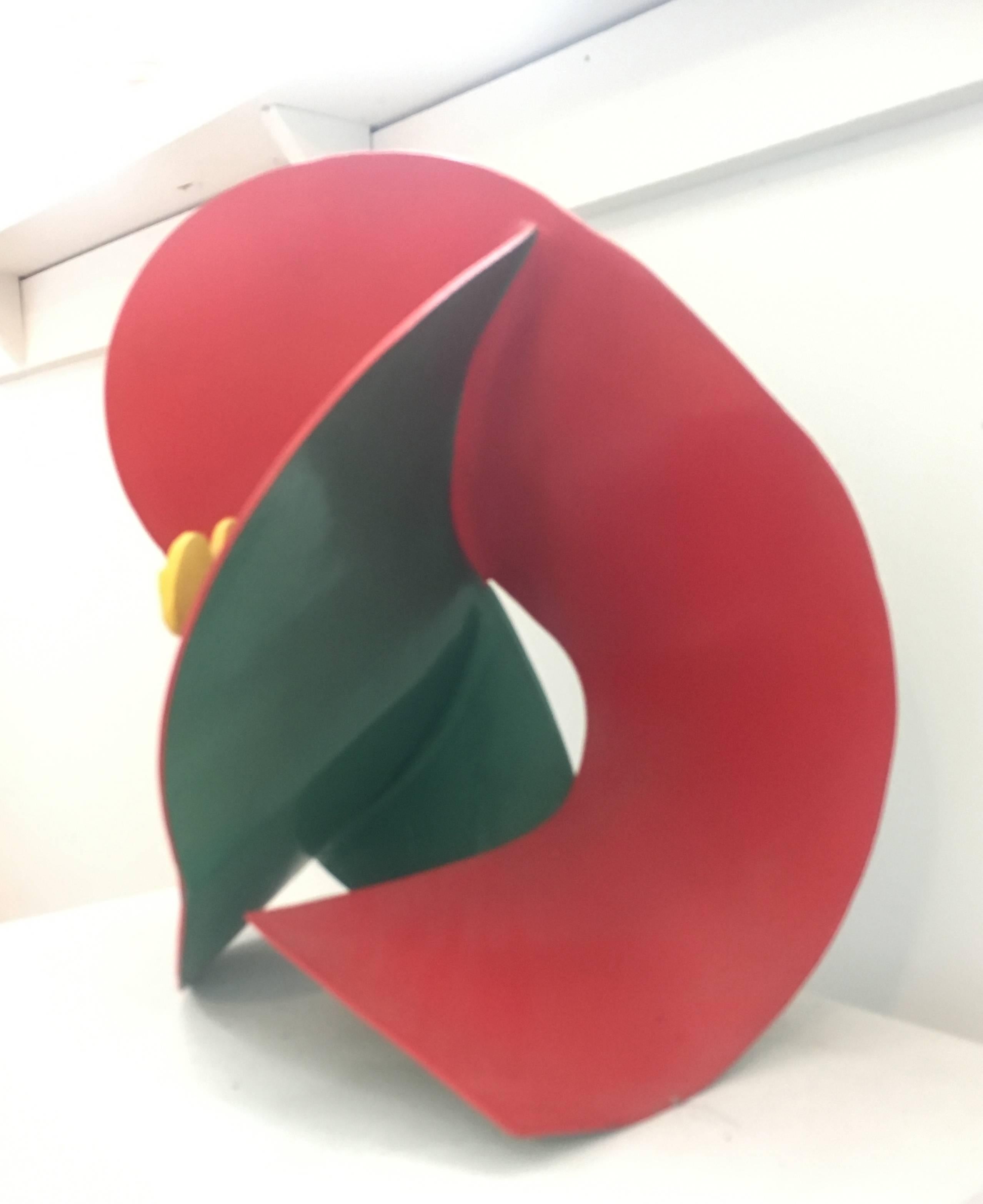 Small abstracted flower sculpture in mid century modern style
red, yellow, and green painted aluminum
14 x 14 x 14 inches

This small, contemporary abstract sculpture made of bright red painted aluminum is perfectly suited for a tabletop, pedestal,