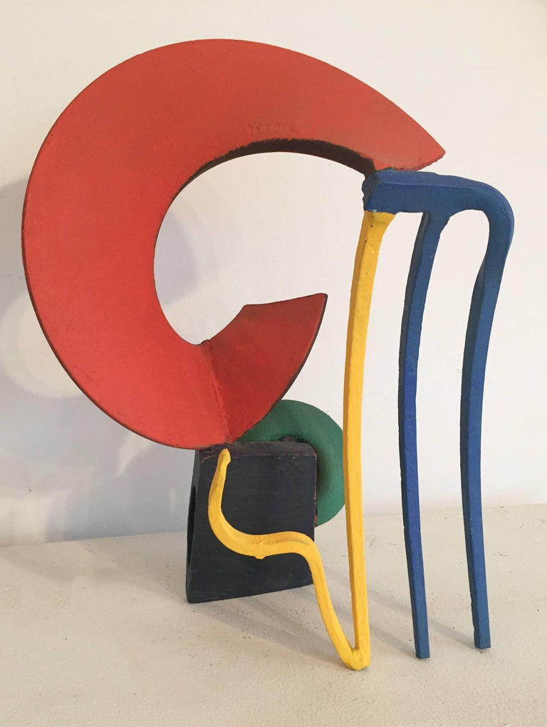 Small abstract sculpture in mid century modern style
red, blue, yellow, green and black painted steel 
15 x 11 x 7 inches 

This small, contemporary abstract sculpture made of colorfully painted steel and wood is perfectly suited for a tabletop,