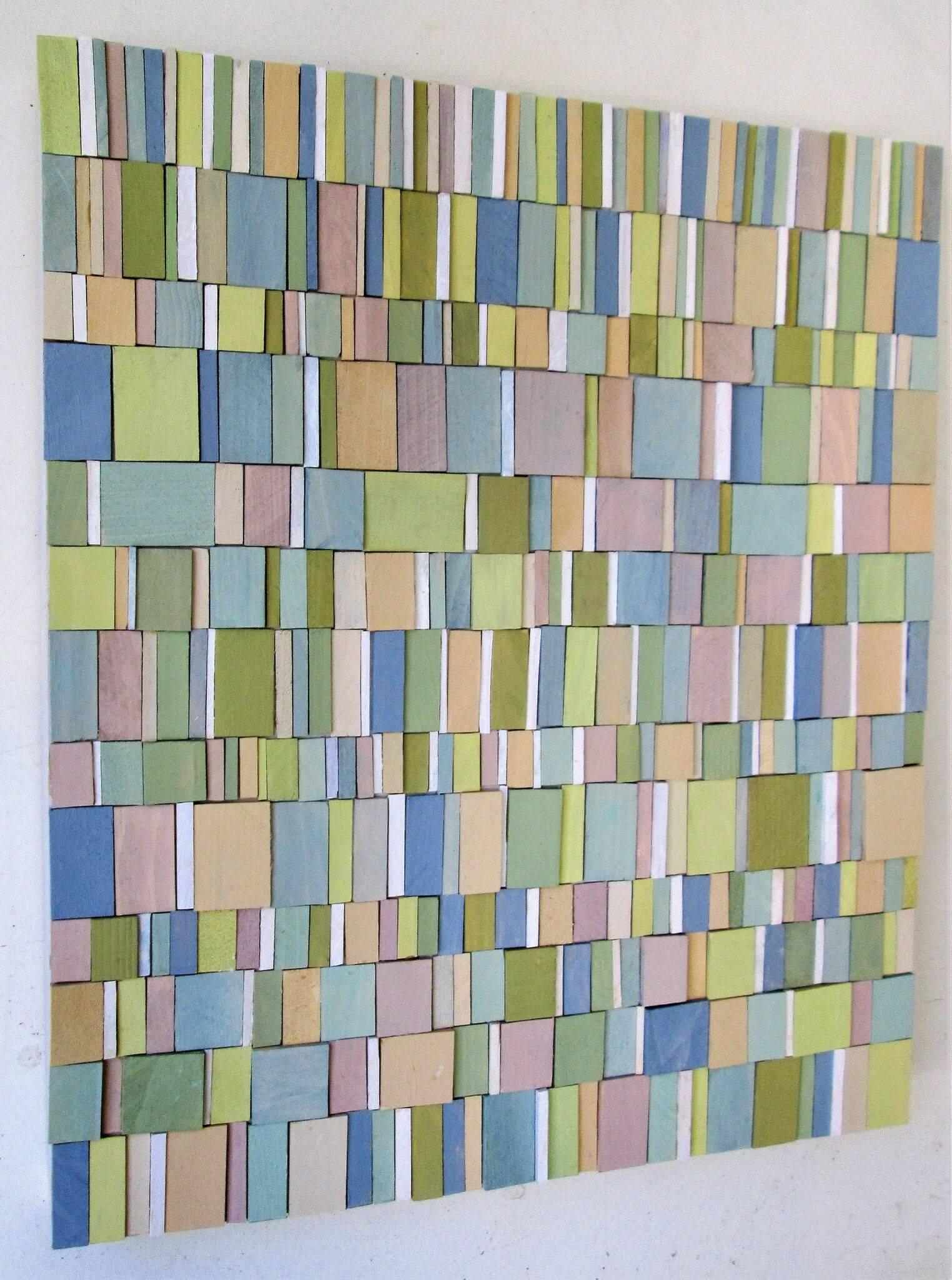 abstract three-dimensional wall sculpture, acrylic and wood on panel 
carved strips of painted wood in shades of pastel blue, green, pink, and purple
22 x 19 x 2 inches, can be oriented vertically or horizontally 

Dynamic and graphic wall sculpture