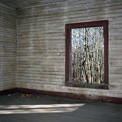 Abandoned Mill House: Brown room with window view of the outside