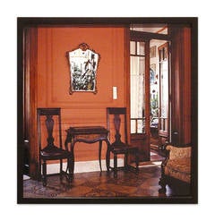 Vintage Buenos Aires: Waiting room with red wall and two chairs