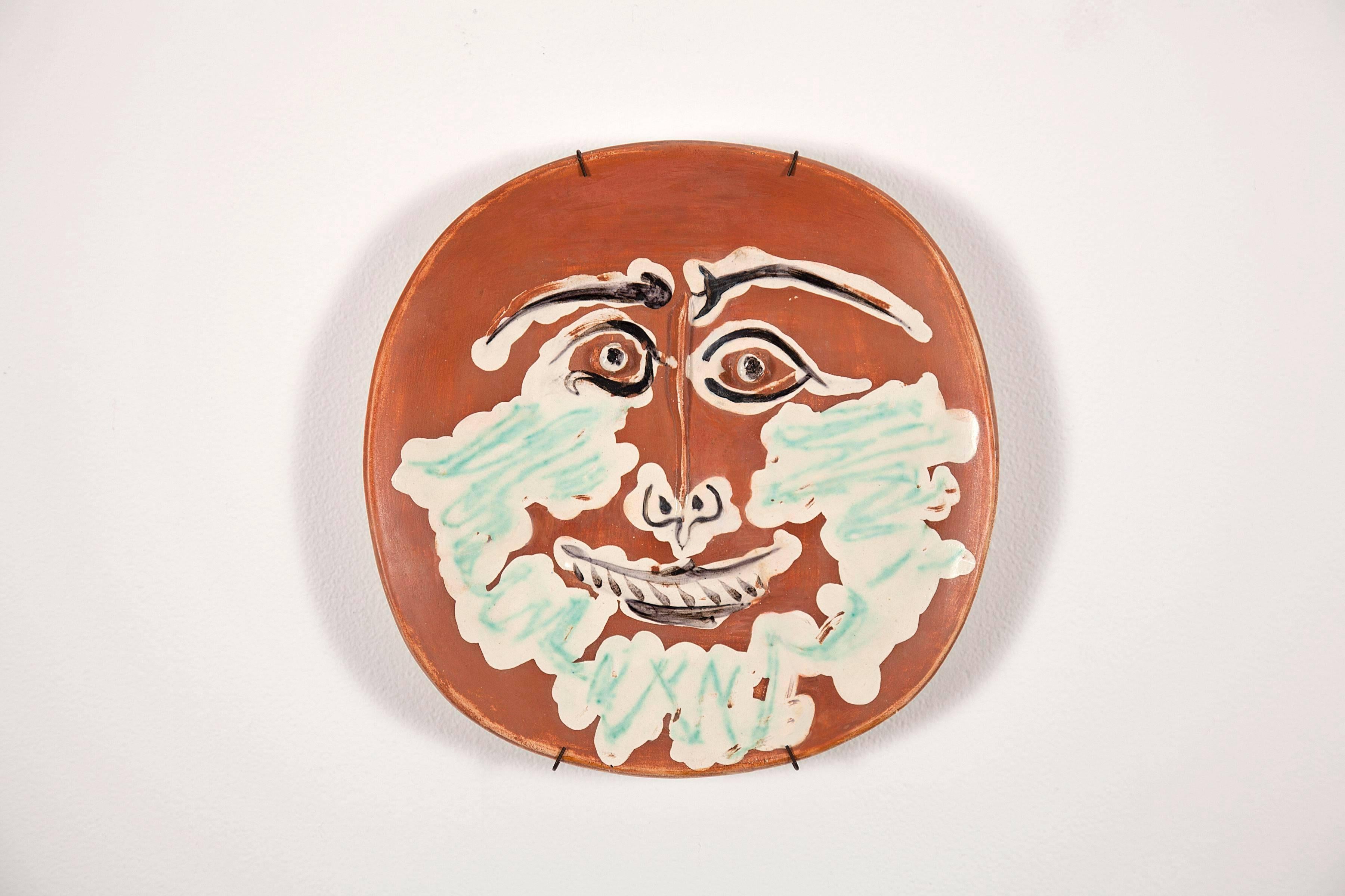 Bearded face in white earthenware - Art by Pablo Picasso
