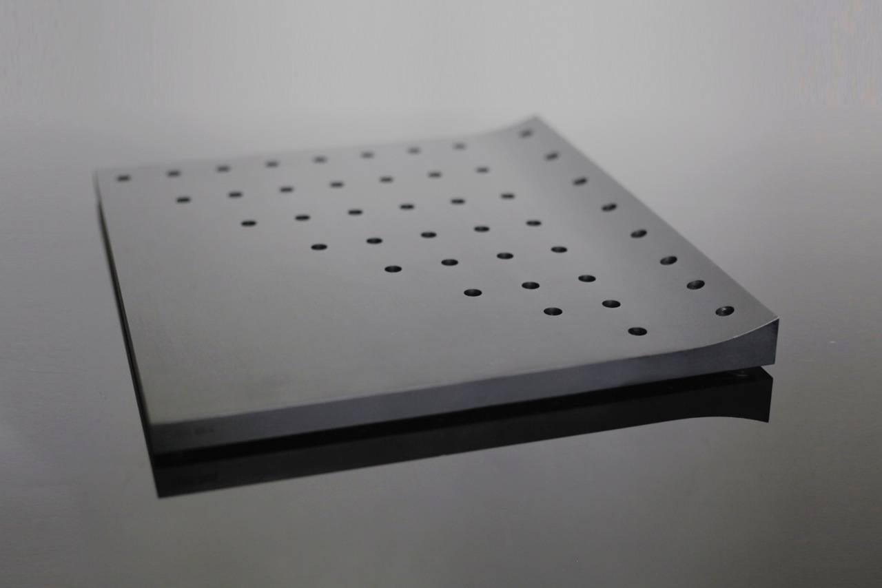 Alon Seifert is a designer, writer, mixed media artist and a great believer in causes he believes in. LUMEN44 is Alon's take on the centuries old Menorah design. It is made of a 6lbs. slab of anodized aluminum, with eight rows of CNC drilled holes,