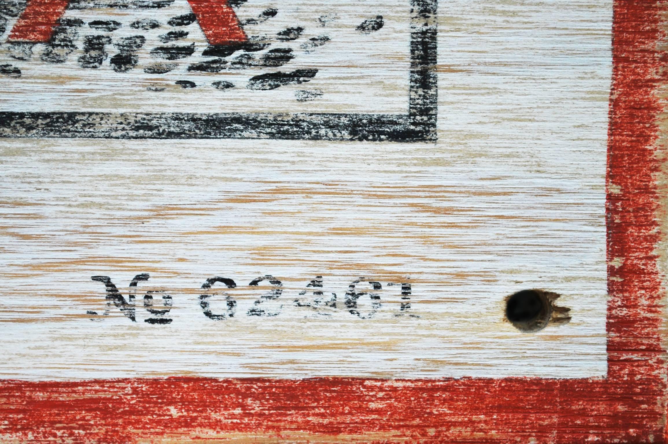 "Beyond This Point" from Steve Carver's "Is It Safe?" series is a black and white text based piece with a red arrow pointing down at an eye. The eye has a red 'X' over it. Another piece from the series, titled "Trauma