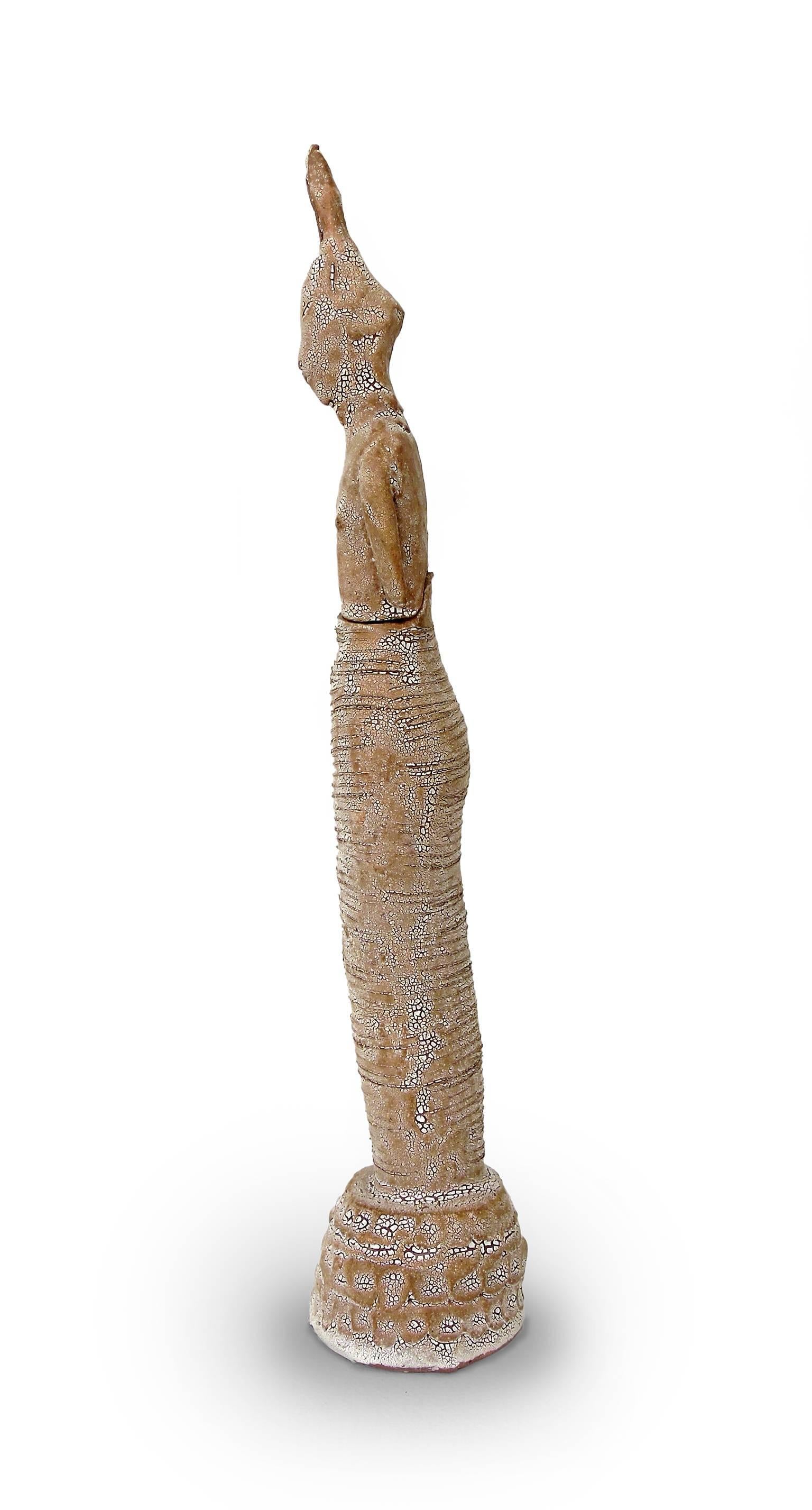 Robin Whiteman is better known for her intricately rendered porcelain creations. This terracotta piece with its crackled glaze is an example of Whiteman working in a looser, more stylized manner. 'Covered Jar - Hare' is a vertical figure at once