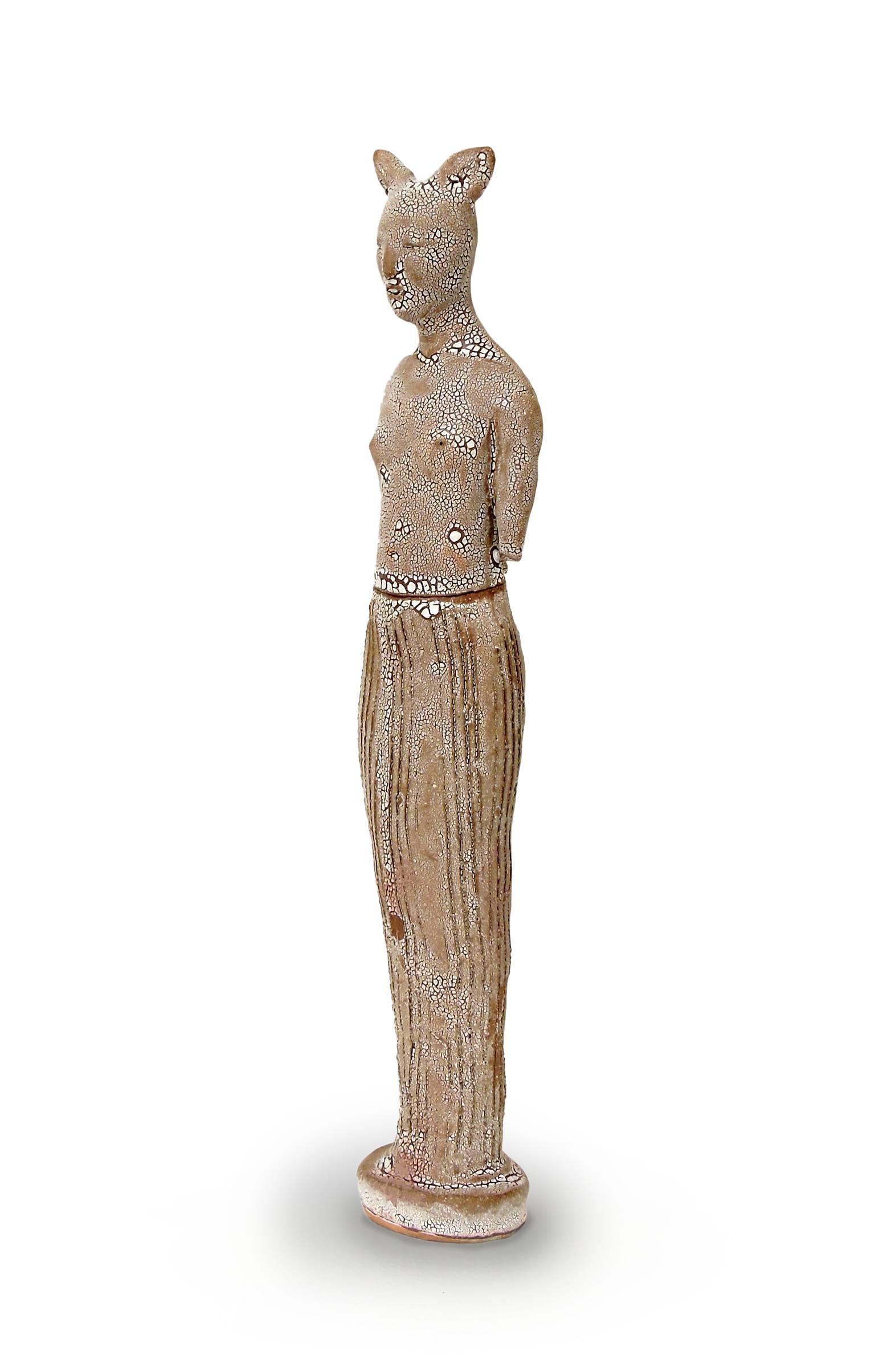 Robin Whiteman's cat jar is fired brown terracotta with a crackled white glaze. It is an example of Whiteman working in a looser manner than her porcelain figures. Covered Jar - Cat is vertical feminine figure with the feel of a worn and meaningful