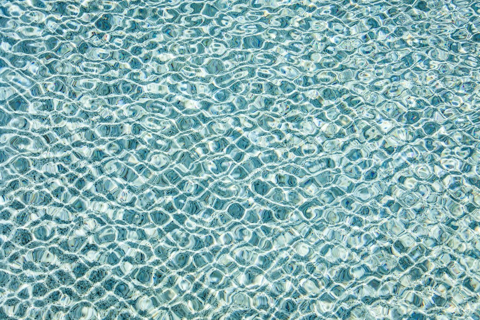 H2O l - large format photograph of sun reflections on pool water surface