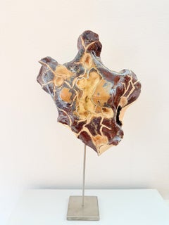 Gaia. Emergence Series. Amber-toned ceramic sculpture with a feminine essence