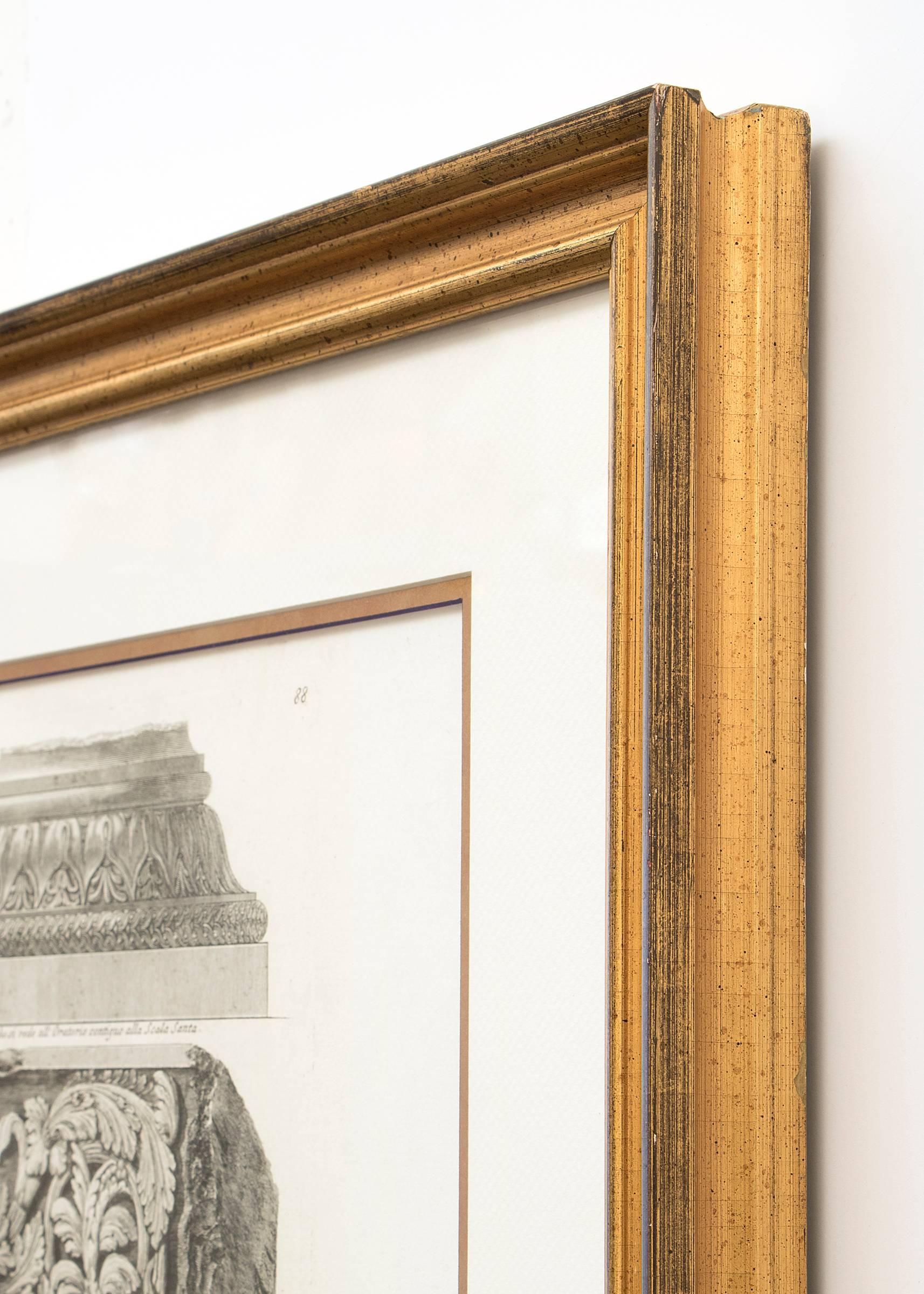Collection of two 19th century Neoclassical black and white etchings by Giovanni Battista Piranesi housed in gold frames. Left: Giovanni Battista Piranesi, Ornamental Frieze, 19th century, signed lower left.  
Right: Giovanni Battista Piranesi,